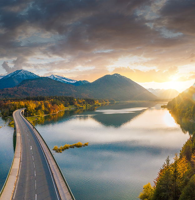 Sunrise over a mountainous landscape showing an optimistic outlook for the global economy